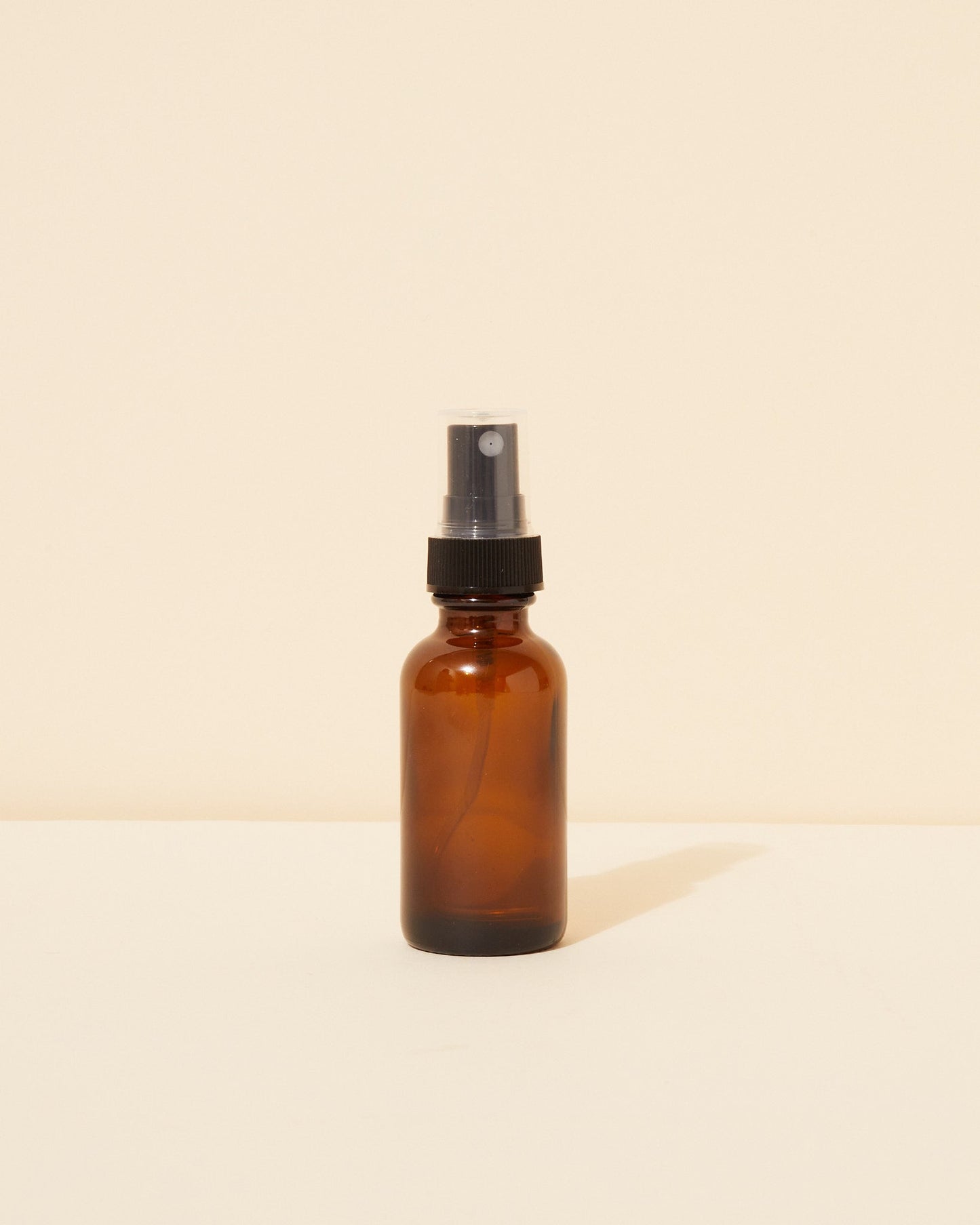 1oz / 30ml translucent amber glass spray bottle