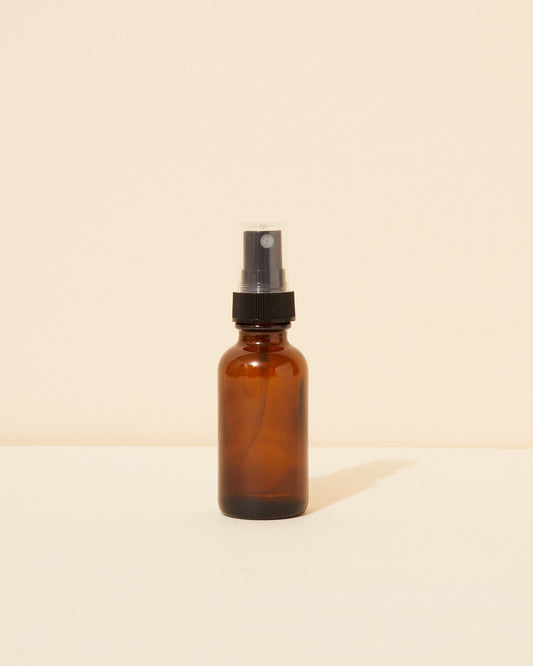 1oz / 30ml translucent amber glass spray bottle